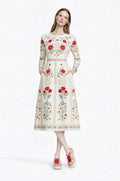 May include: A cream-colored, long-sleeved dress with a floral pattern featuring red and blue flowers. The dress has a round neckline, pockets, and a fitted waist. The model is wearing red and white patterned sneakers. __etsy:7972540903