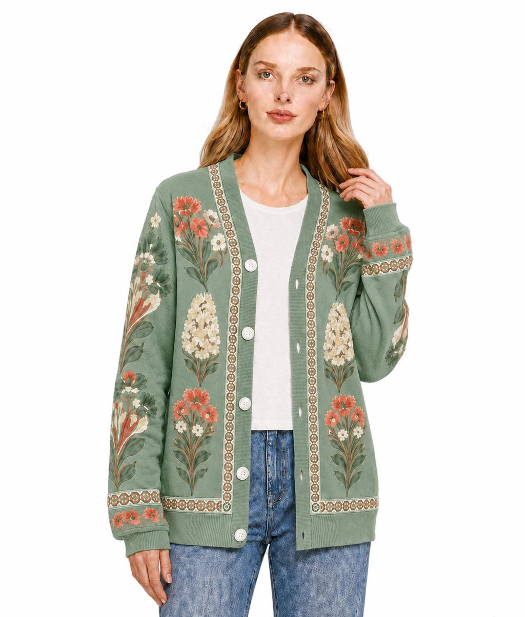 May include: A sage green long-sleeve cardigan featuring a V-neckline, a button-front closure, and a decorative border along the placket. The garment is adorned with a repeating floral print in shades of orange, cream, and dark green.