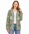 May include: A sage green long-sleeve cardigan featuring a V-neckline, a button-front closure, and a decorative border along the placket. The garment is adorned with a repeating floral print in shades of orange, cream, and dark green.