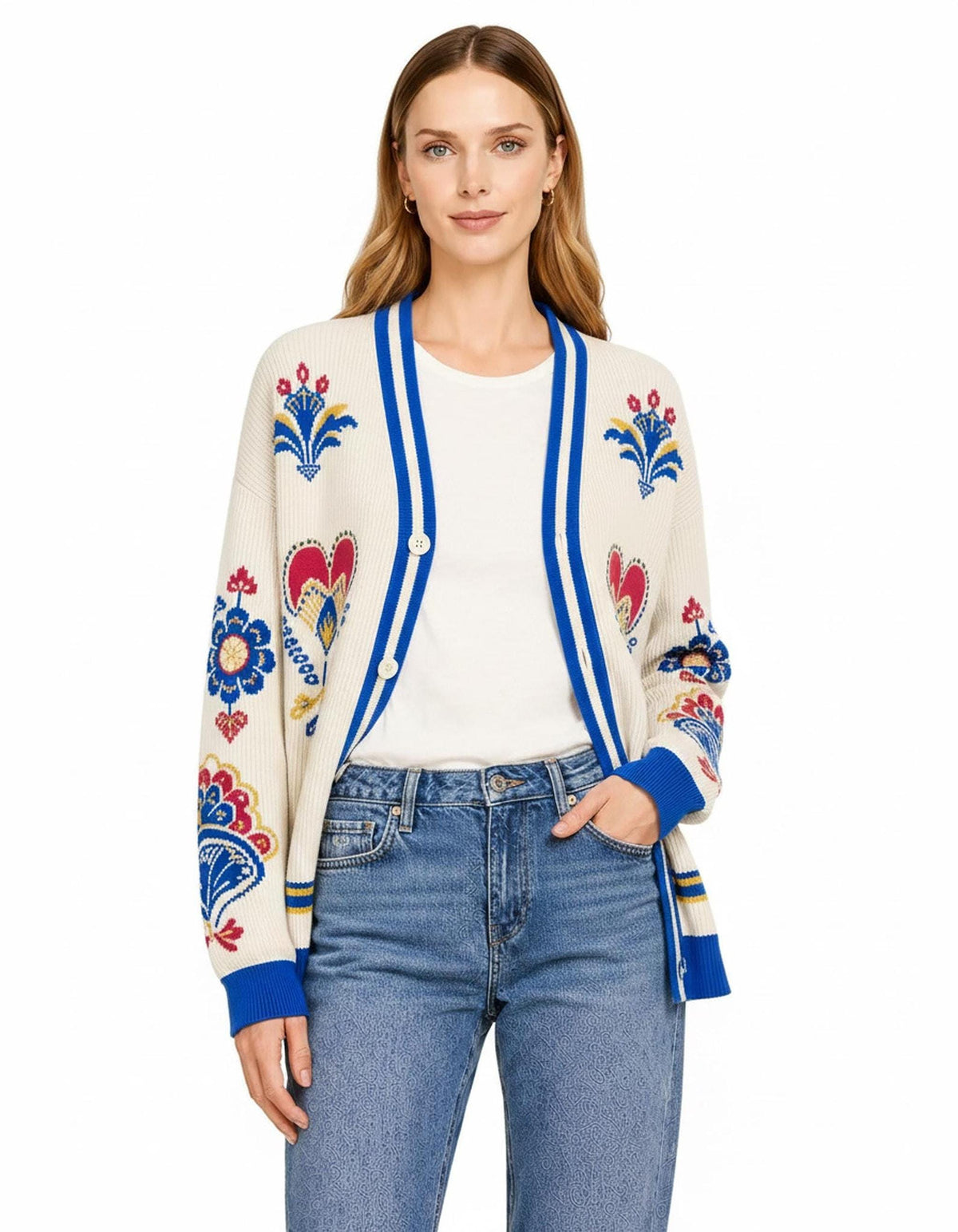 A close-up view of the ivory cardigan buttoned over a white t-shirt and blue jeans, displaying the blue striped trim.