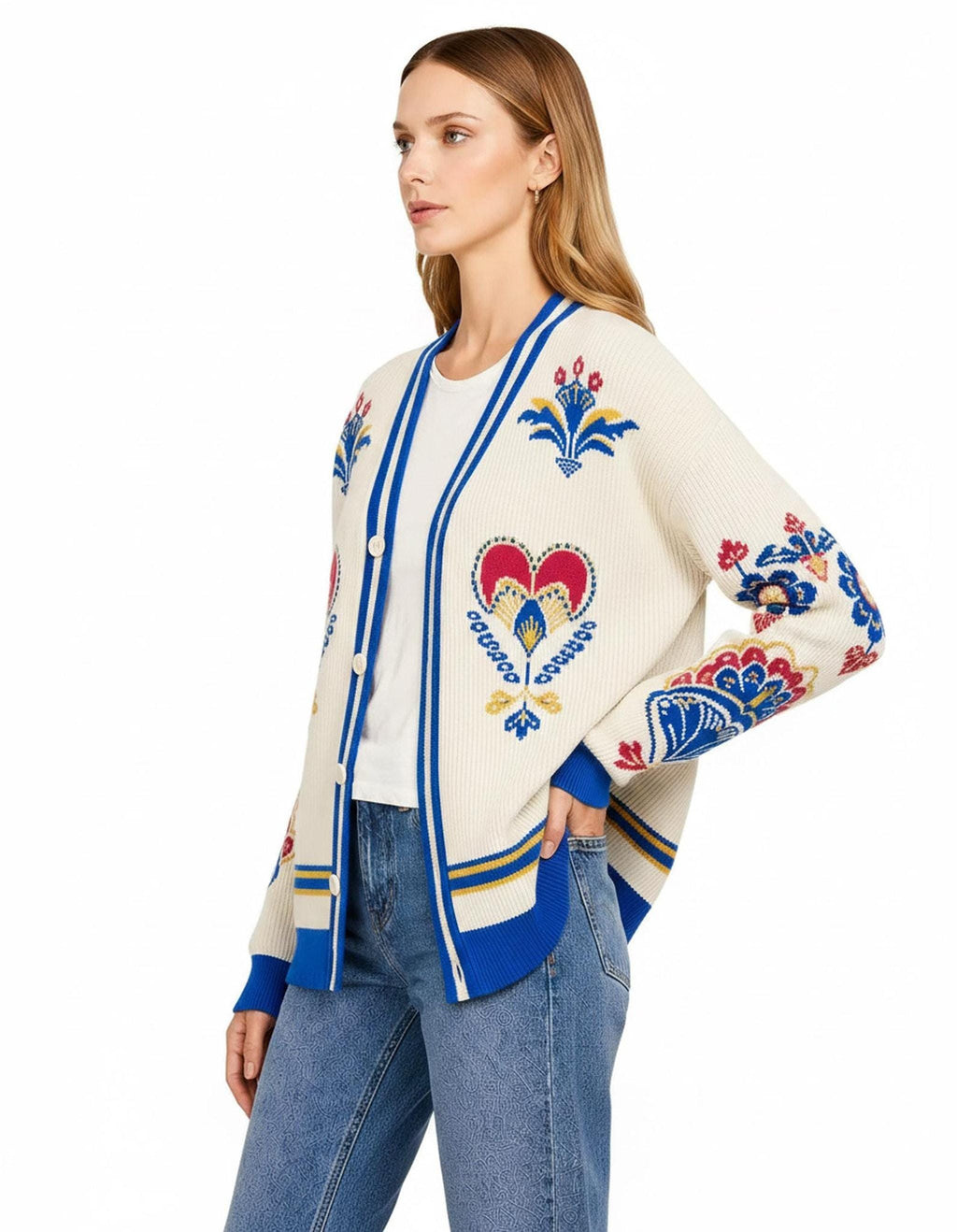 A three-quarter right-side view of the ivory cardigan, highlighting the folk-style knit patterns across the chest and sleeve.