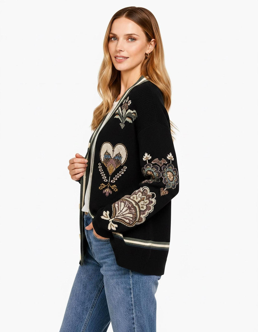 A right-side view of the black knit cardigan, highlighting the ornate floral sleeve designs and ribbed hem.