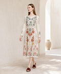 May include: A cream-colored midi dress featuring long sleeves and a round neckline. The garment is decorated with intricate floral embroidery in shades of sage green, terracotta, mustard yellow, and dusty pink, extending from the bodice to the hem.